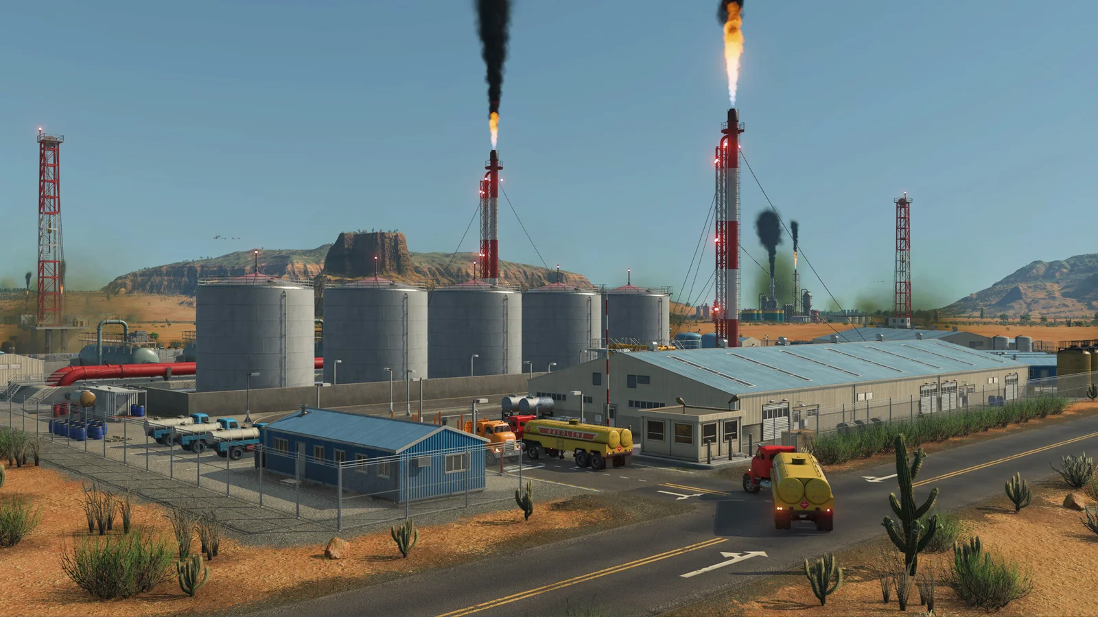 Cargo trucks and storage tanks beside a Transport Fever 3 industrial complex